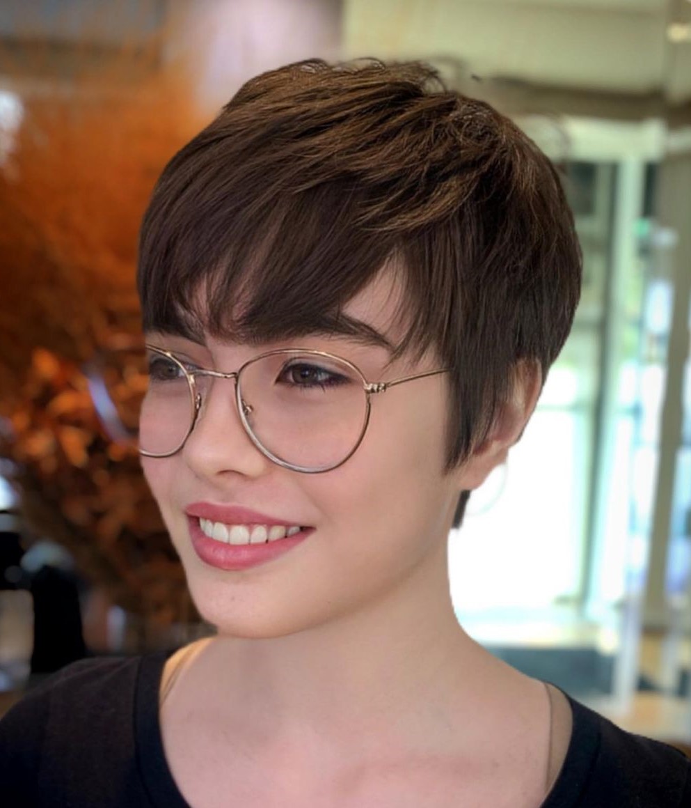 Neat Layered Pixie with Bangs and Glasses